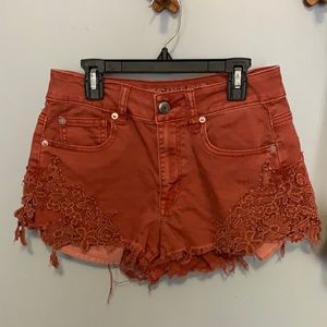 Rust colored American Eagle Outfitters High Rise Denim Shorts with Lace/Crochet